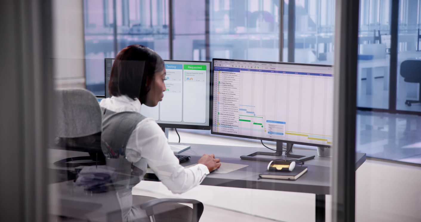 construction manager reviewing Gantt chart on computer